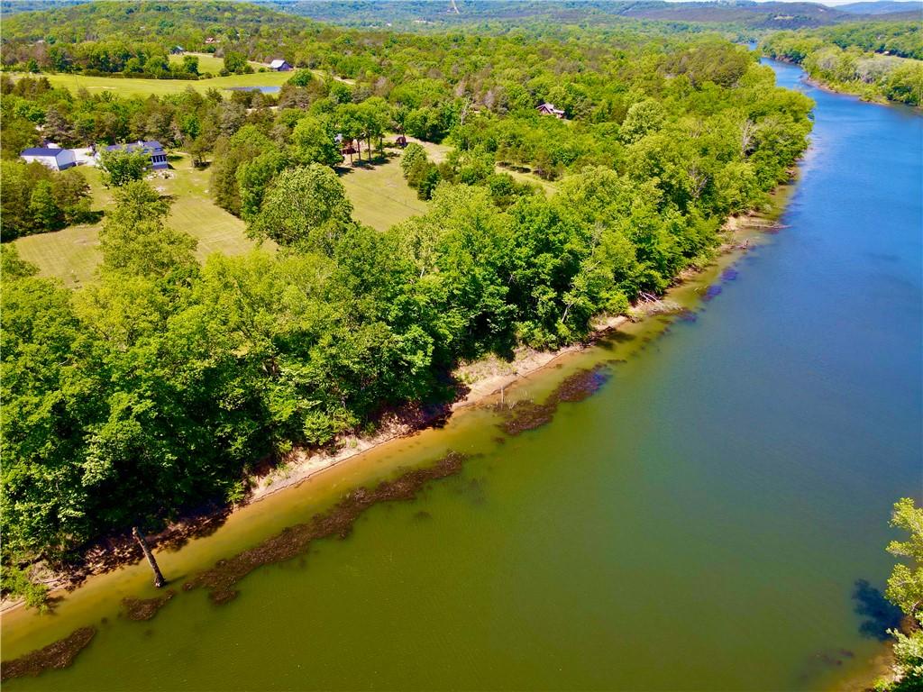 Image 4: Expansive riverfront property featuring a broad wa