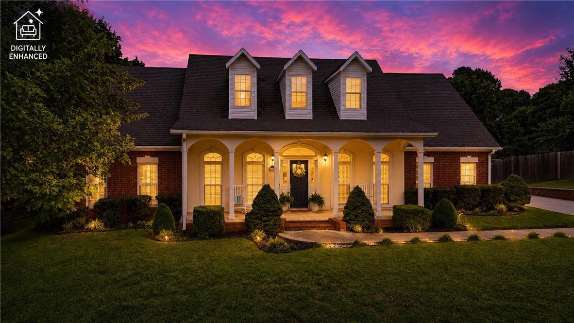 Image 2: Brick facade residence featuring a covered porch w