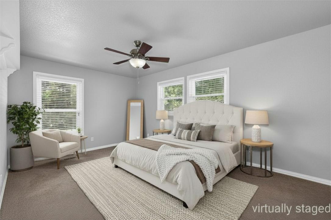 Image 3: Carpeted bedroom with light gray walls, white trim