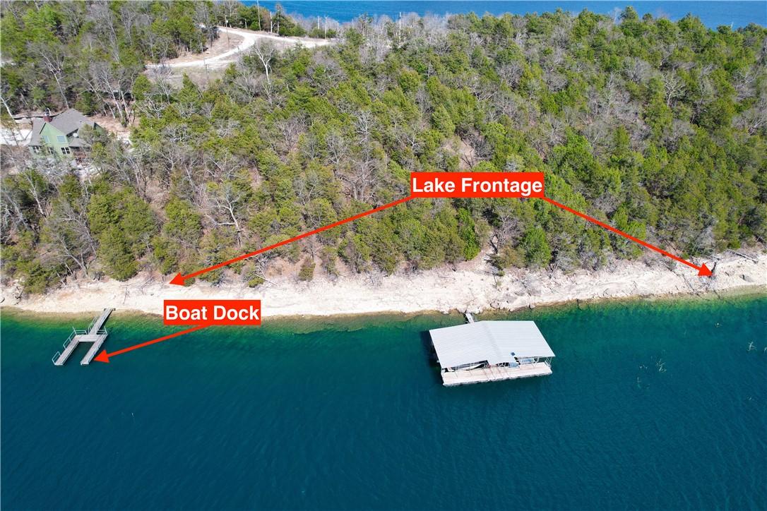 Image 1: Expansive lake frontage with a private boat dock a