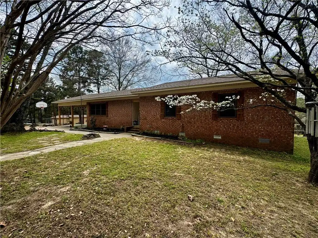 Image 1: View of front of property featuring crawl space, a