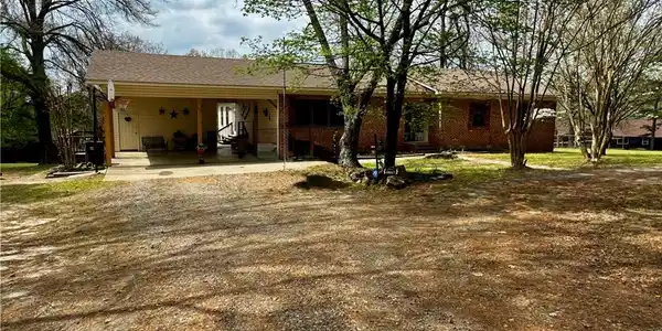 Image 2: Ranch-style house featuring an attached carport an