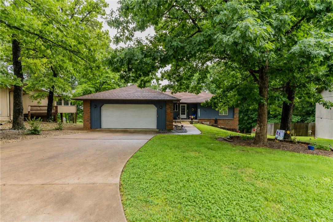 Image 1: Exterior featuring a two-car garage, concrete driv