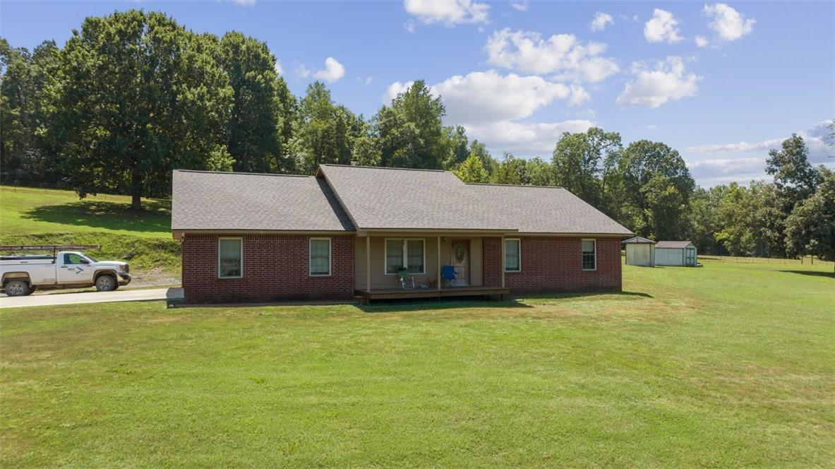 Image 3: manicured 4 acres around one of the two homes on t