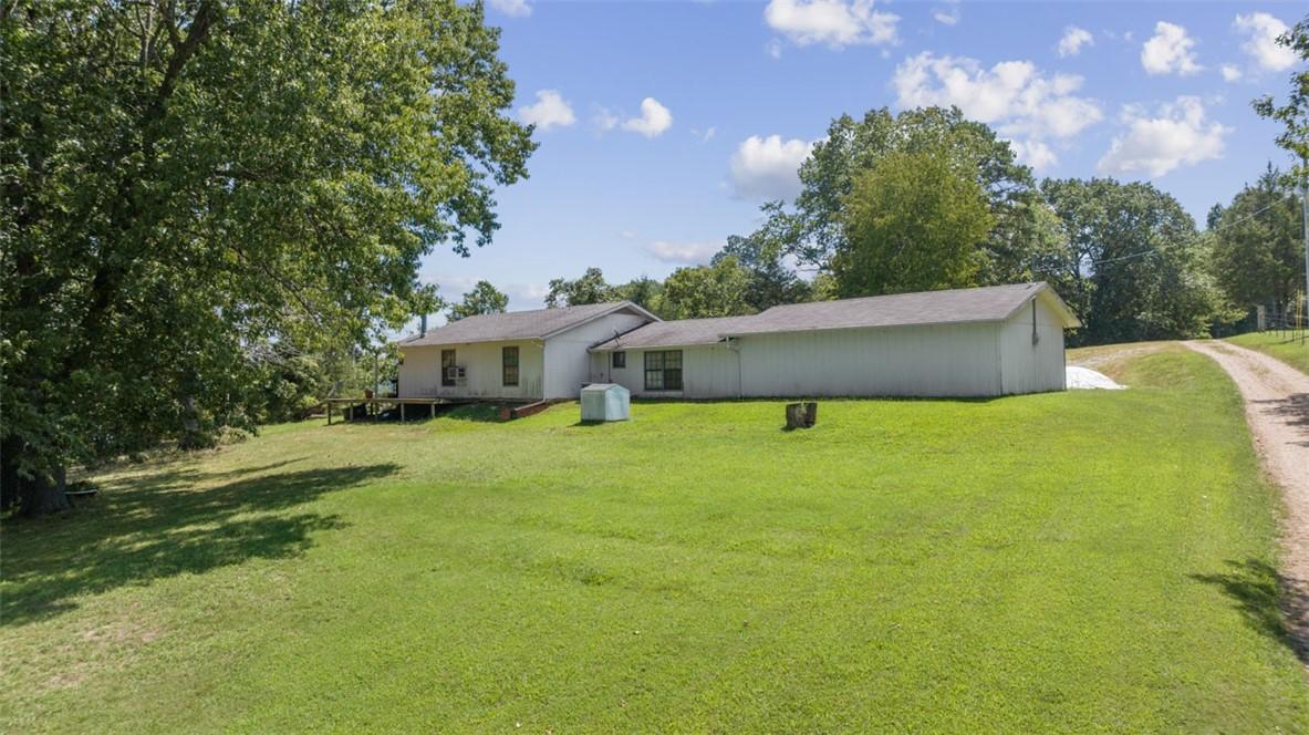 Image 4: original home on the land. vacant and needs some u