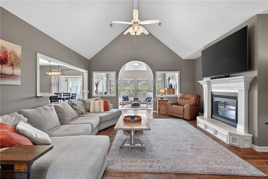 Image 4: Spacious living area featuring a vaulted ceiling a