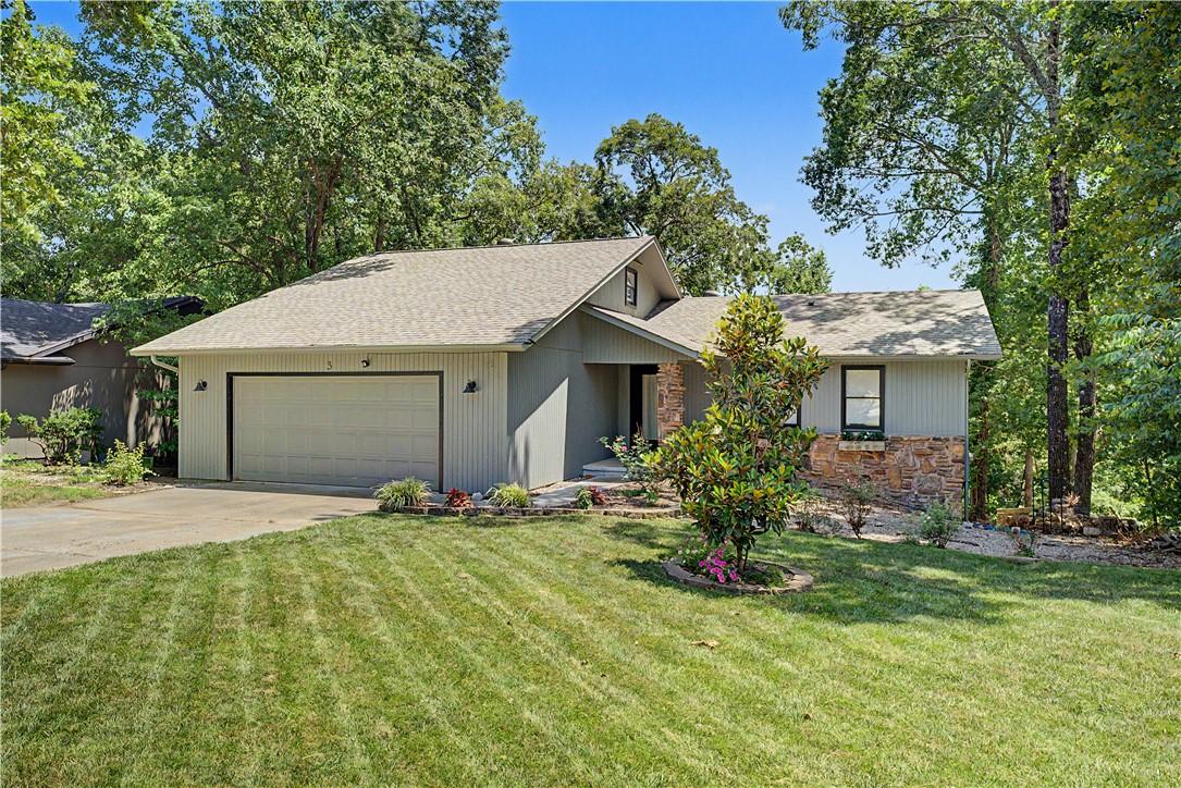 Image 2: Modern ranch-style residence featuring a two-car g