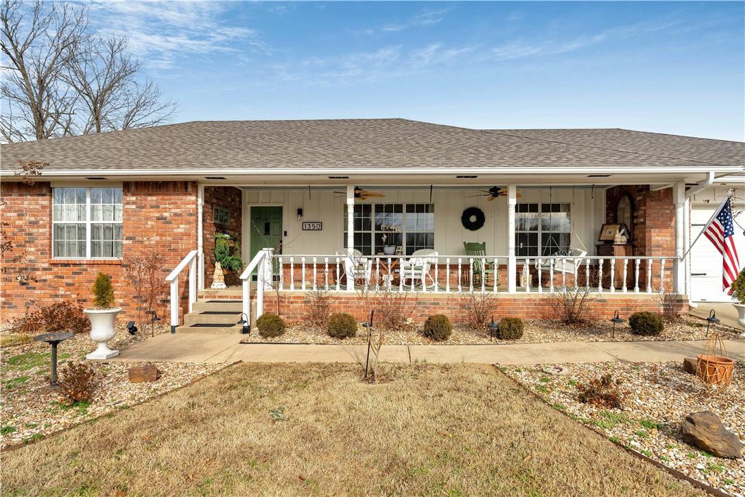 Image 2: Single story home with a porch, roof with shingles