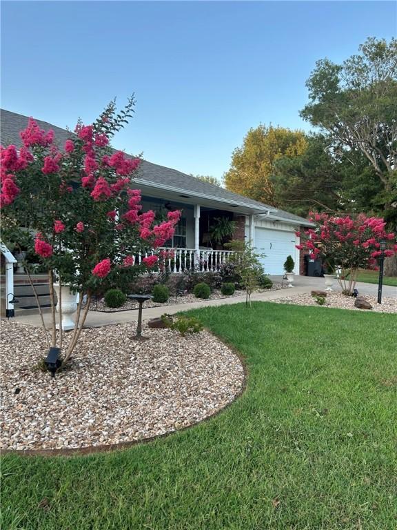 Image 3: View of front of home featuring a front lawn, a po