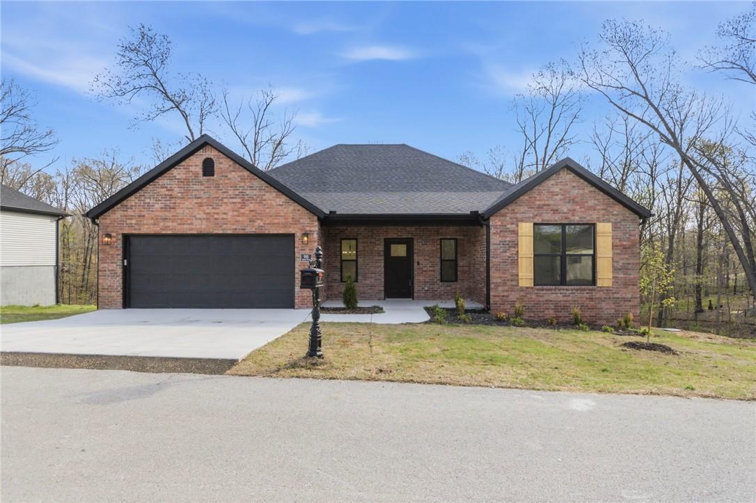 Image 1: View of front of house featuring brick siding, an