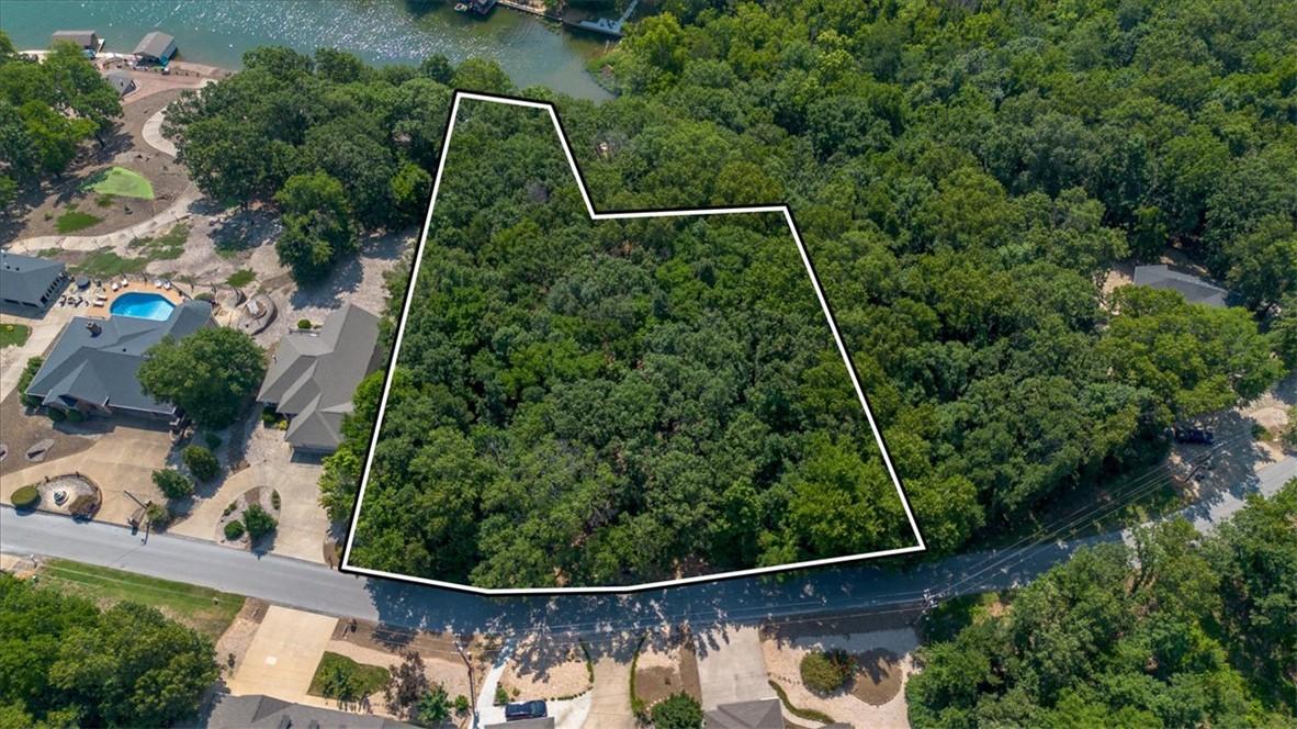 Image 4: Expansive wooded lot offering privacy and natural