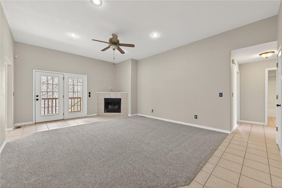 Image 4: Unfurnished living room with light carpet, light t