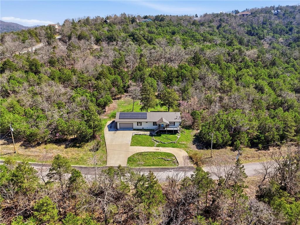 Image 1: Aerial view of property and surrounding area