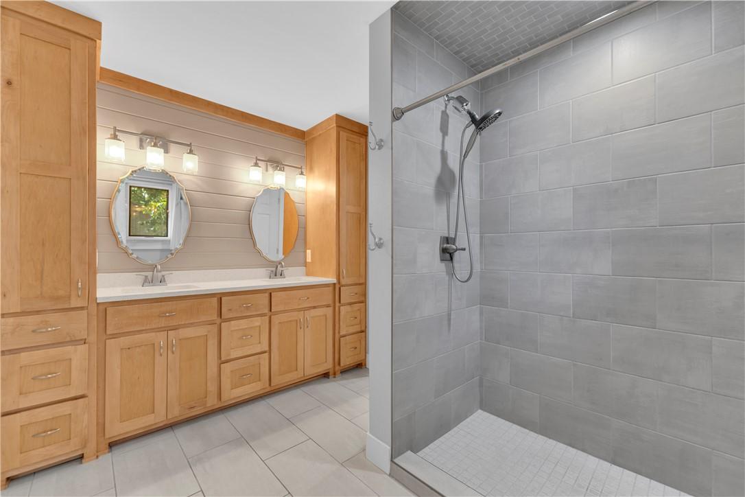 Image 3: Dual vanity with light wood cabinetry, white count