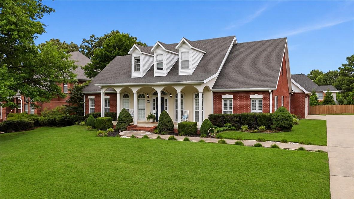 Image 3: Traditional-style residence featuring a brick faca