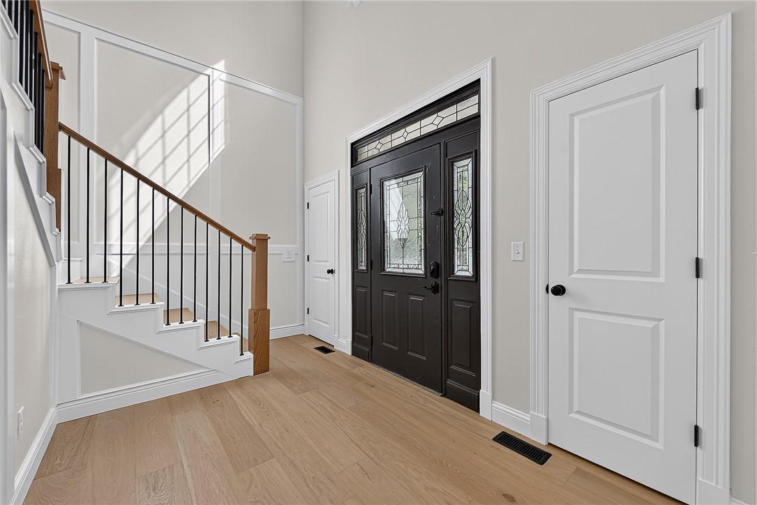 Image 2: Hardwood-finish flooring throughout the space