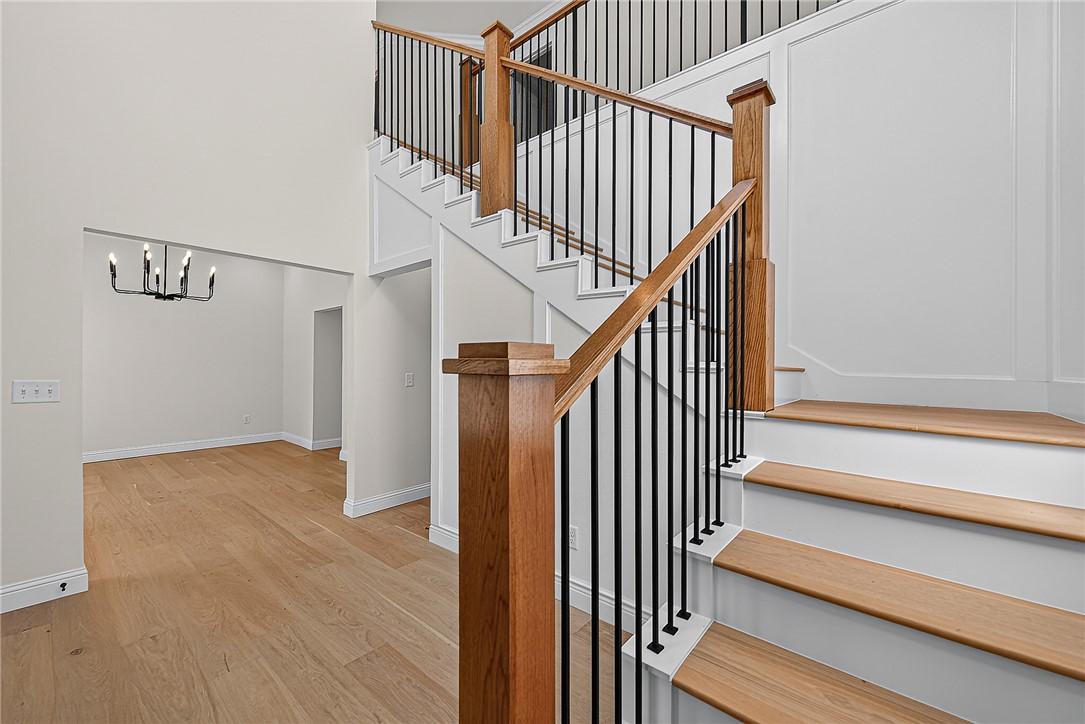 Image 4: Hardwood flooring, wood-finish stair treads, black