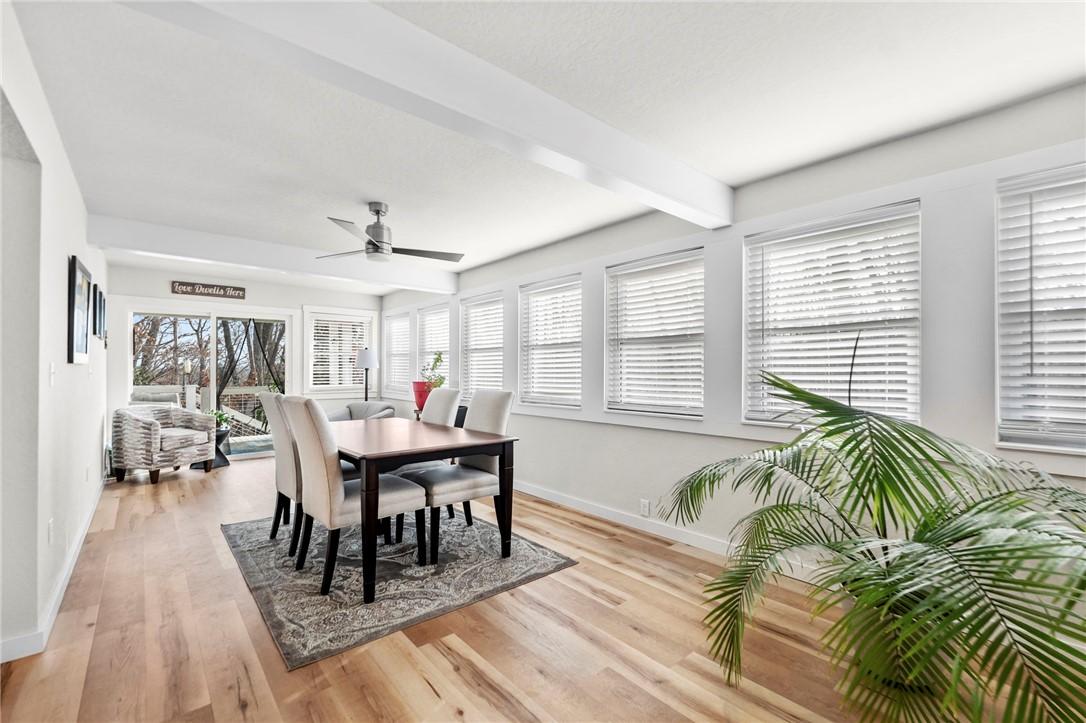 Image 1: Dining area with beamed ceiling, light wood-type f