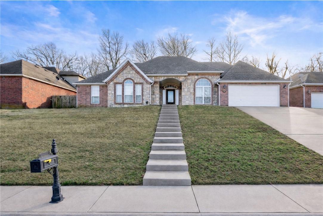 Image 1: Ranch-style house featuring a front yard, concrete