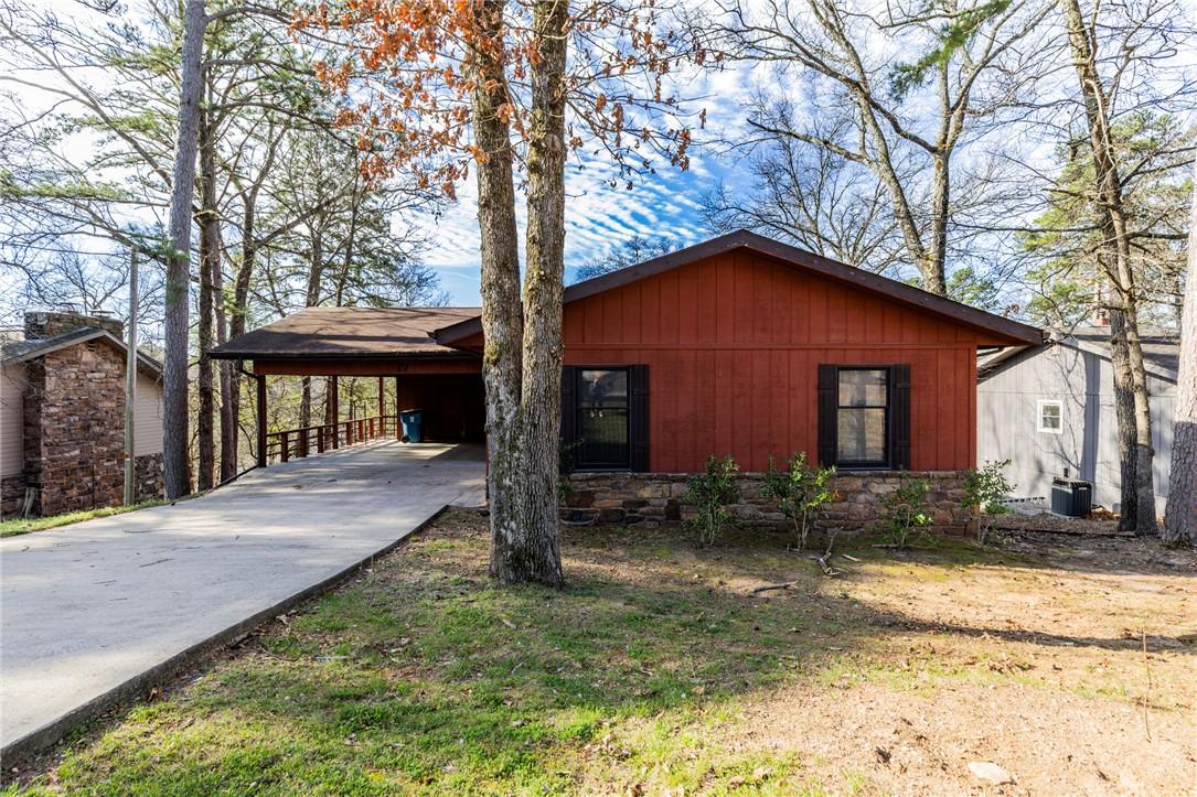Image 4: View of front facade with an attached carport and