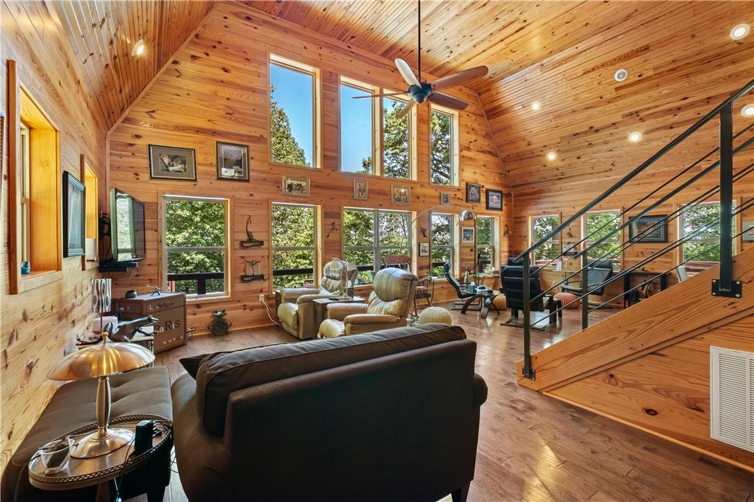 Image 4: Open living area with a wall of windows looking ou