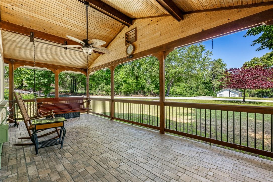 Image 2: Covered porch featuring a vaulted wood-finish ceil
