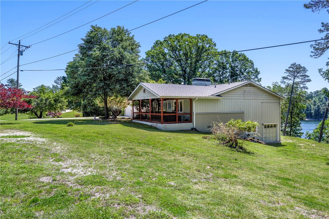 Image 4: Exterior residence featuring a covered porch with