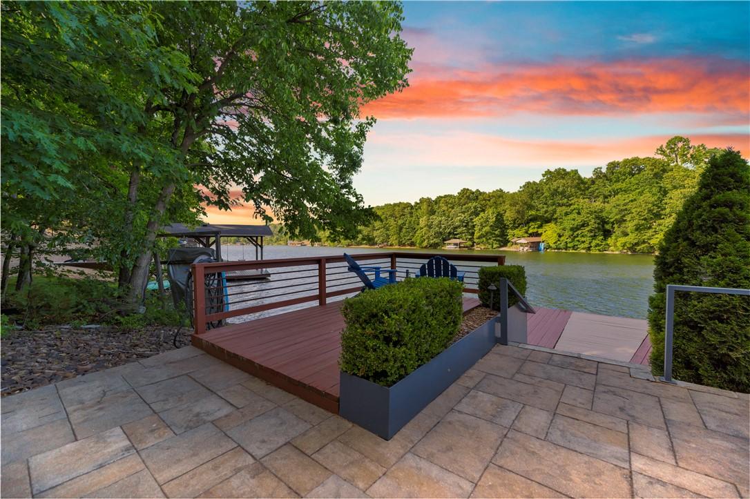 Image 1: Stone patio with a composite deck, stainless steel