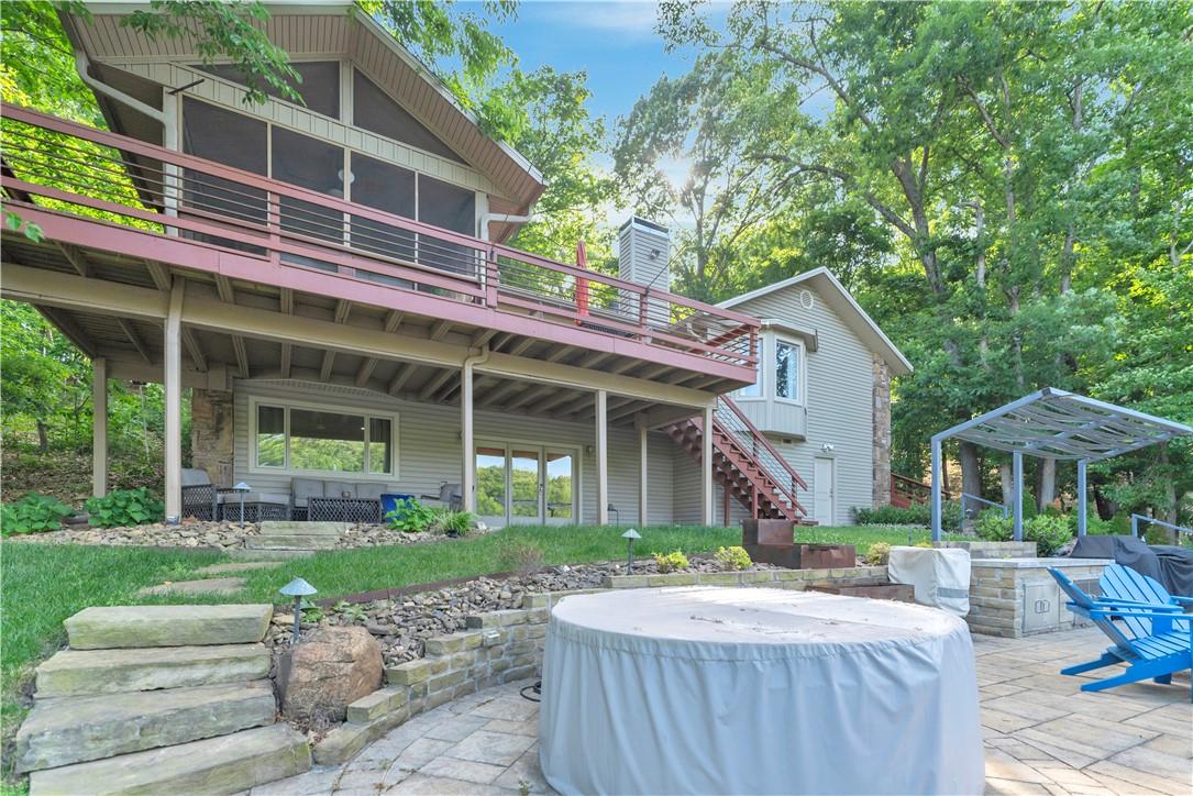 Image 3: Multi-level outdoor living space featuring a paver
