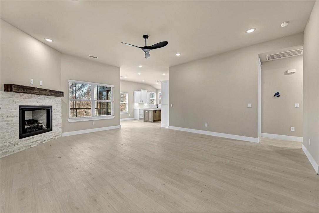 Image 3: Unfurnished living room with recessed lighting, a