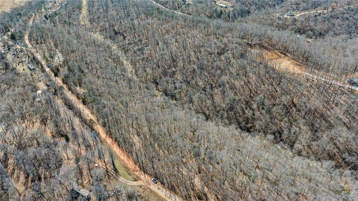 Image 2: Aerial view of property and surrounding area with
