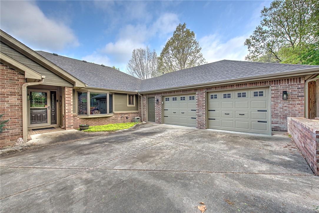Image 2: The property features a beautiful front door entry