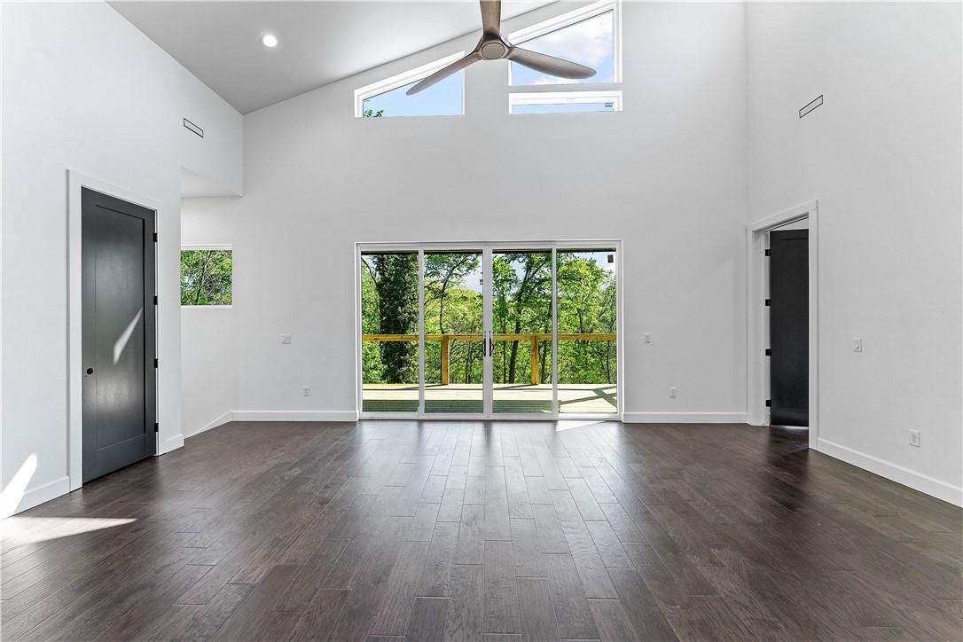 Image 3: Natural light floods this main-level living area.