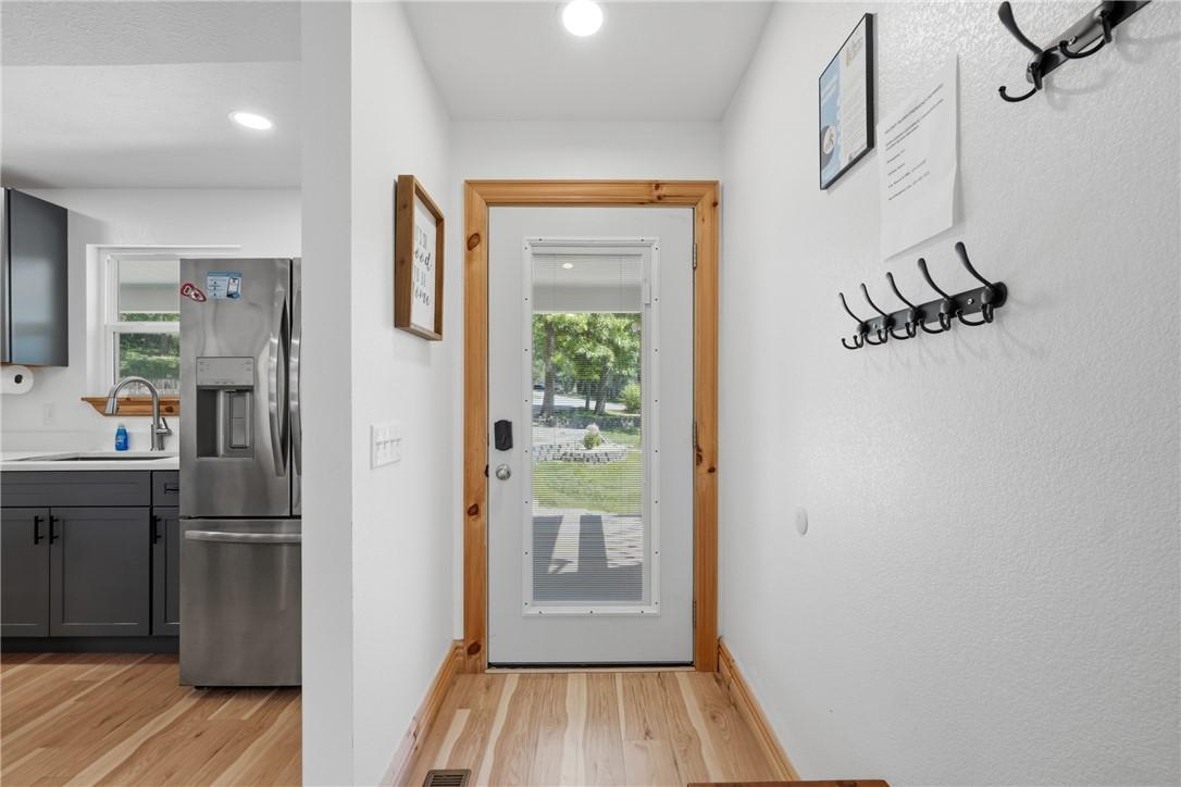 Image 4: Entryway featuring light wood-finish flooring, a w