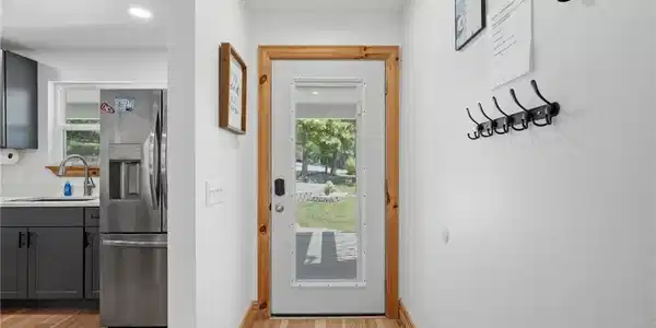 Image 4: Entryway featuring light wood-finish flooring, a w