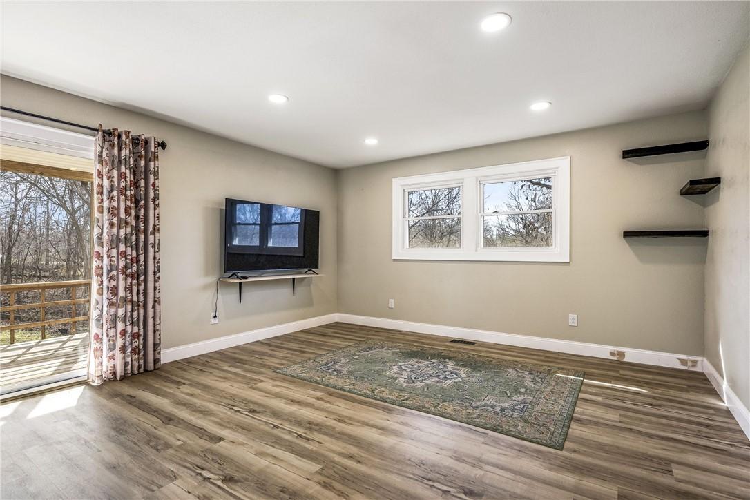 Image 2: Unfurnished living room with wood finished floors