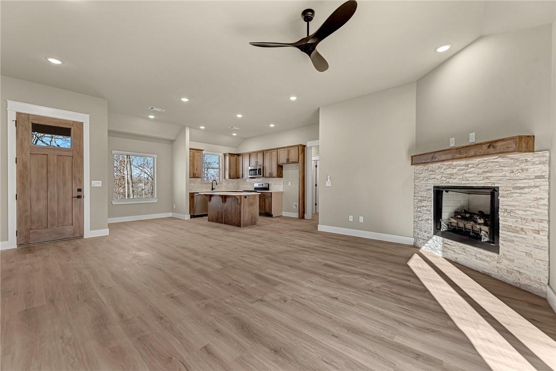 Image 3: Unfurnished living room featuring a ceiling fan, l
