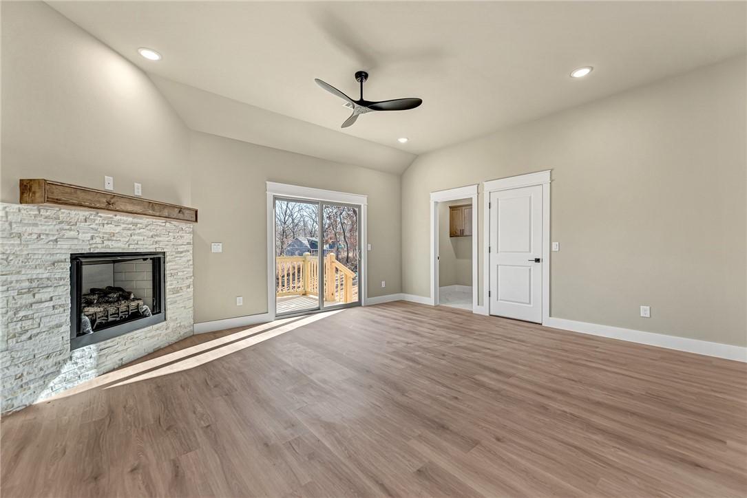 Image 4: Unfurnished living room with wood finished floors,
