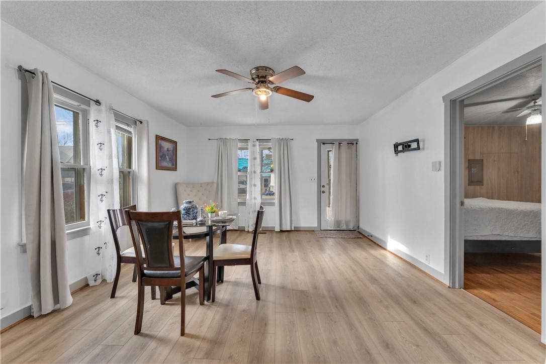 Image 3: Dining room featuring a ceiling fan, a textured ce
