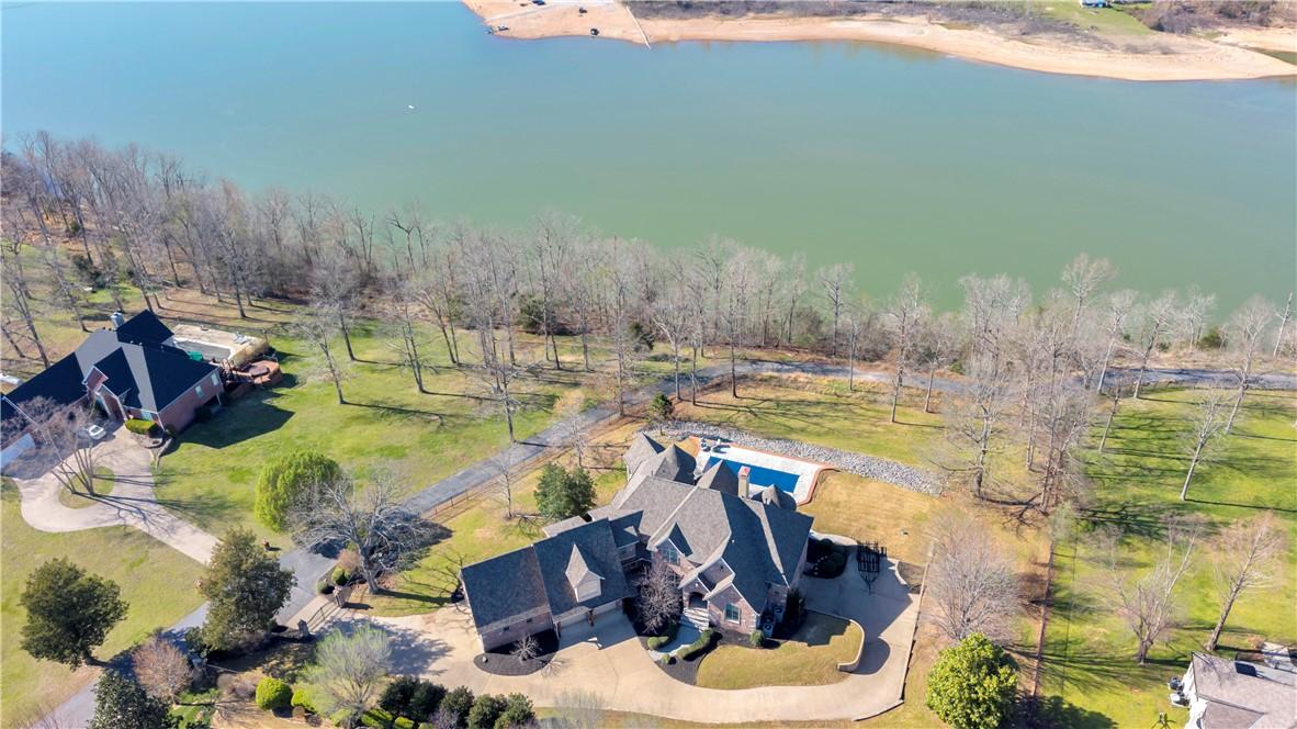 Image 1: Aerial view of property and surrounding area