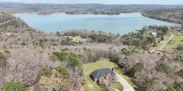 Image 2: Bird's eye view of a nearby body of water and a he