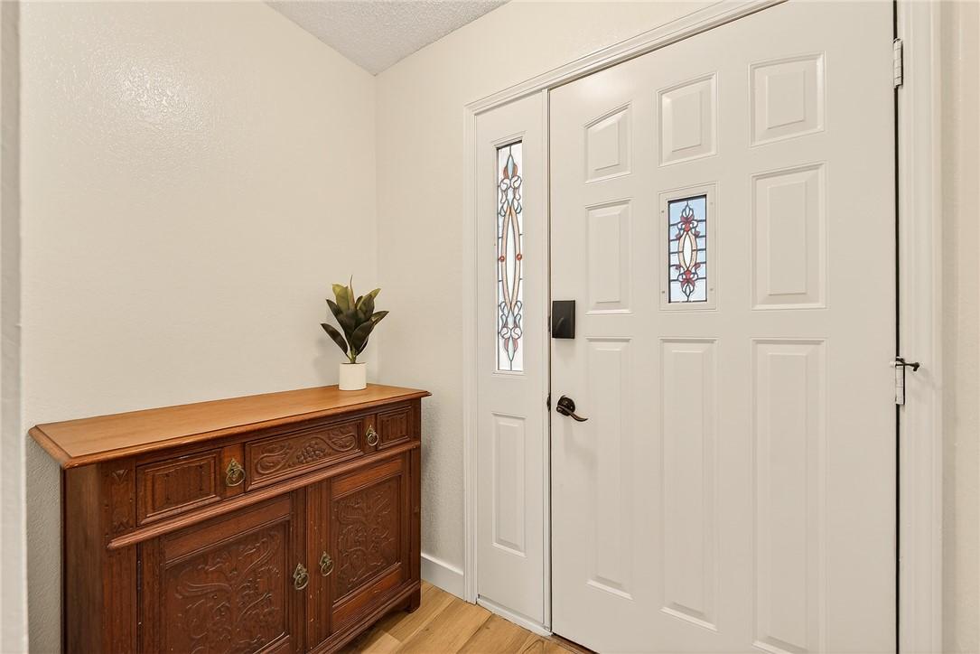 Image 3: Entrance foyer with original stained glass detail