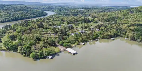 Image 2: Bird's eye view of a nearby body of water and a he