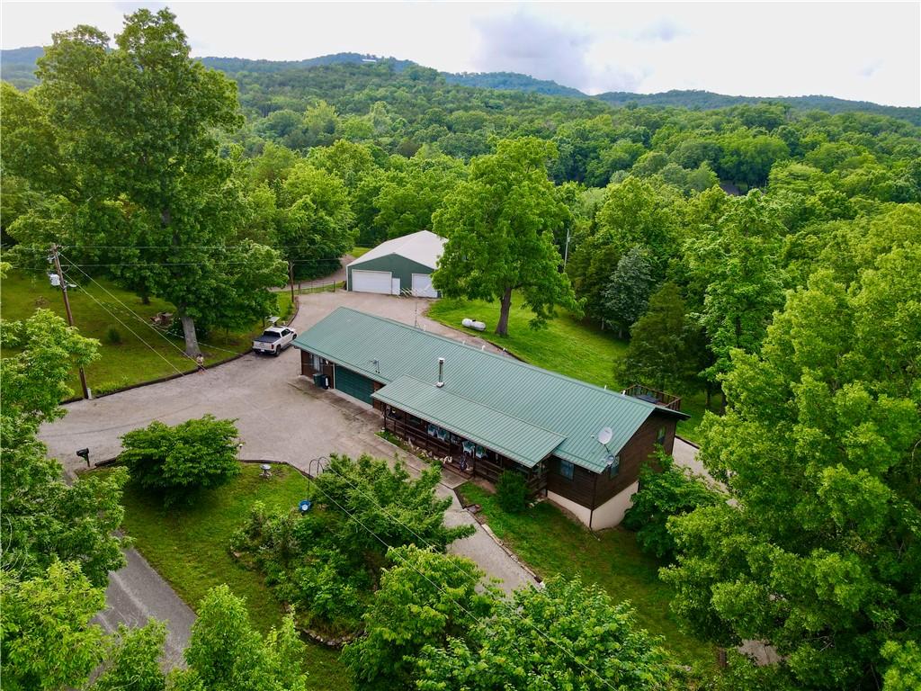 Image 2: Expansive property featuring a main residence with