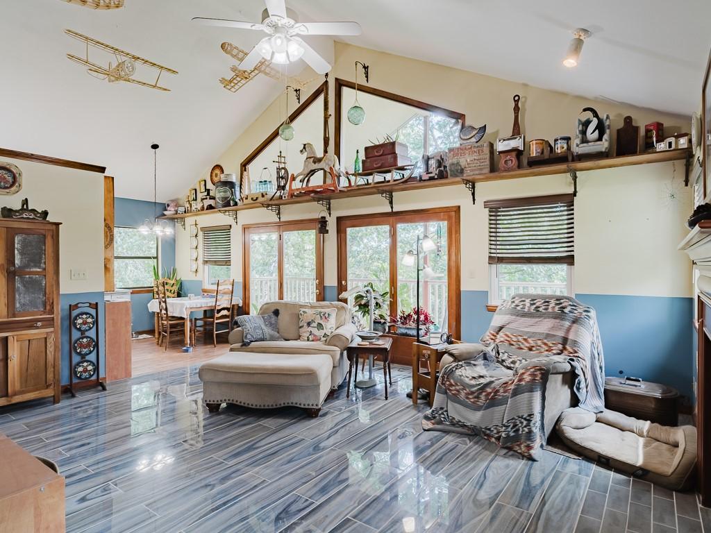 Image 3: Vaulted ceilings with exposed beams complement the