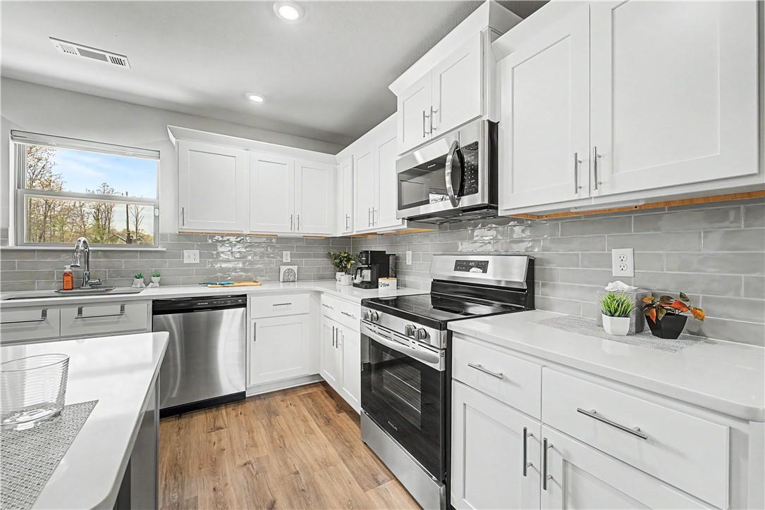 Image 2: Spacious kitchen with lots of work space.