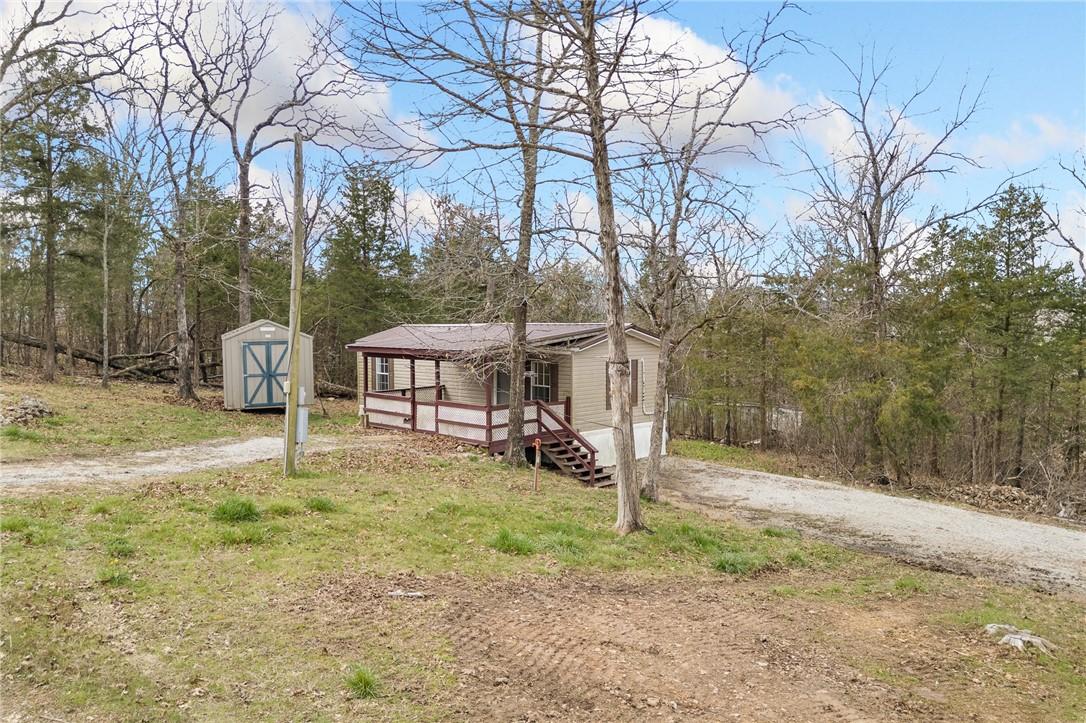 Image 2: Manufactured / mobile home featuring dirt driveway