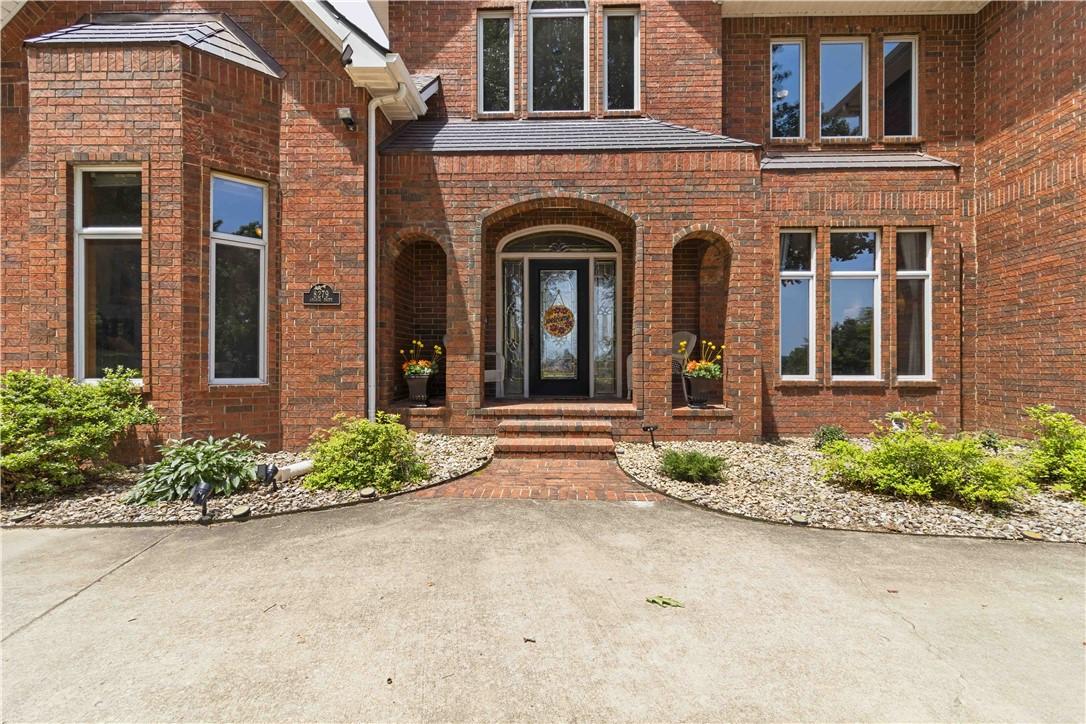 Image 4: Brick facade residence featuring a recessed entry