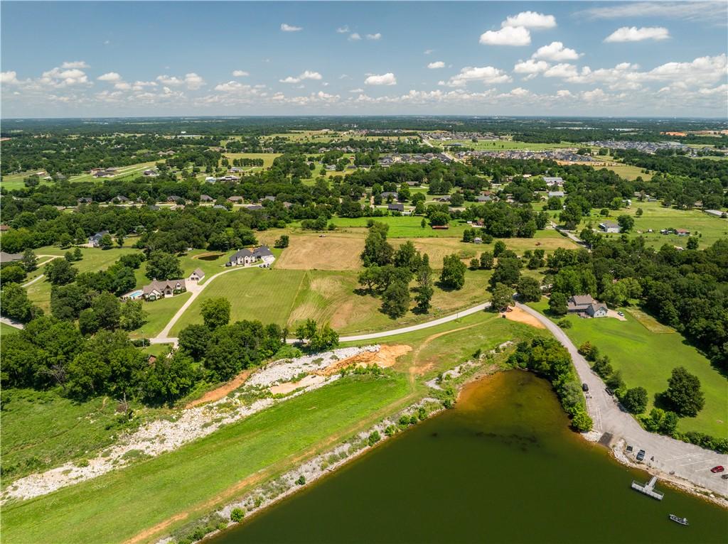 Image 1: Expansive aerial showcasing a large body of water,
