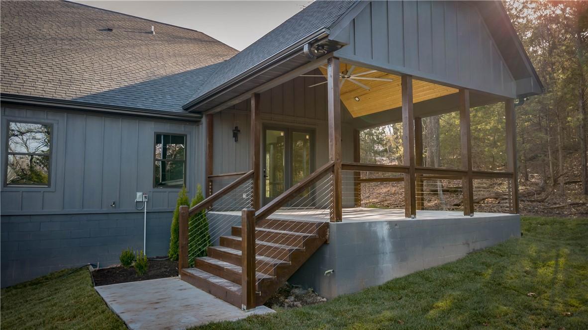 Image 3: Doorway to property featuring roof with shingles,